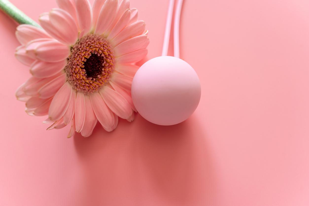 Pink flower and sphere representing pelvic floor strength